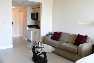 a living room with a couch and a table at Amazing Studio - Walking Distance To Cocowalk in Miami