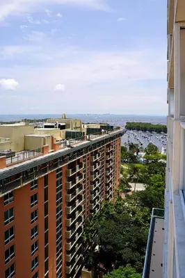 a view from the balcony of a building at Stunning 12th Floor Studio In The Heart Of Grove in Miami