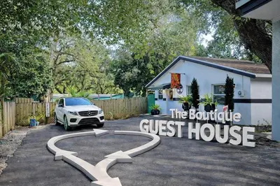 a car parked in front of a guest house at The Boutique Guest House in Miami