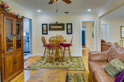 a living room with a couch and a table and chairs at El Portal Vacation Rental about 9 Mi to Miami! in Miami