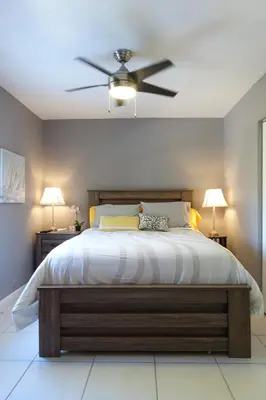 a bedroom with a bed with a ceiling fan at Miami Beach Villa with Sparkling Pool! Sleeps 10+! in North Miami Beach