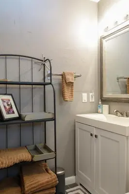 a bathroom with a sink and a towel rack at Miami Beach Villa with Sparkling Pool! Sleeps 10+! in North Miami Beach