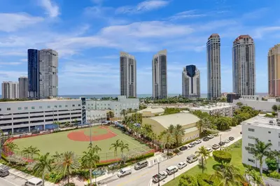 an aerial view of a city with a baseball field at Marina Bay Sunny Isles 1005 in Miami Beach