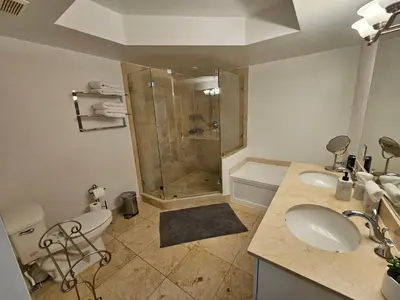 a bathroom with a shower and a toilet and a sink at 3BR Condo in Sunny Isles Beach in Miami Beach