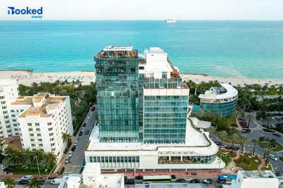 an aerial view of a tall building next to the ocean at Steps to the beach! in Miami Beach