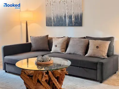 a living room with a couch and a table at Steps to the beach! in Miami Beach