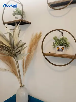 a vase with glasses and a mirror on a wall at MIAMI BEACH HOME NEAR THE OCEAN in Miami Beach