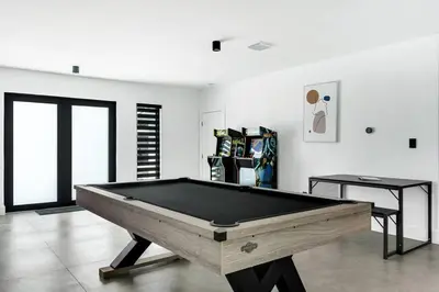 a room with a pool table in a room with at Heated Pool Modern 5 Bedrooms House 10 minutes to the Ocean in Miami