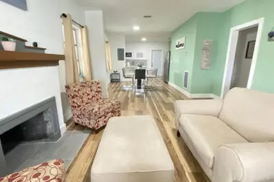 a living room with a couch and a fireplace at Heart of Miami sleeps 10 near Little Havana Beaches in Miami
