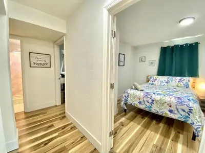 a bedroom with a bed and a large doorway at Lively Home near Downtown, stadium, Wynwood in Miami