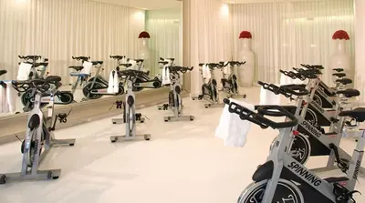 a room with a bunch of bikes in a gym at Water front Icon Brickell, W Hotel building in Miami