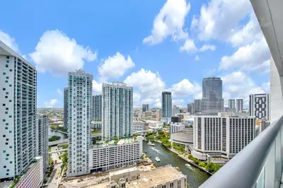 a view of a city with tall buildings and a river at Water front Icon Brickell, W Hotel building in Miami