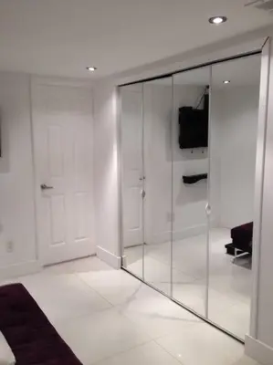 a white room with glass doors and a white floor at Apartamento en Miami Beach sobre la playa in Miami Beach
