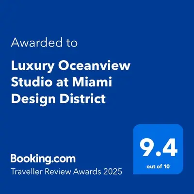 a blue sign with the text awarded to lynyr owlrolet studio at miami at Luxury Oceanview Studio at Miami Design District in Miami