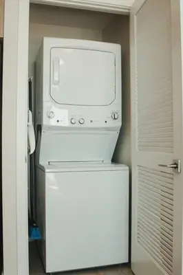 a microwave oven sitting on top of a refrigerator at Luxury Oceanview Studio at Miami Design District in Miami