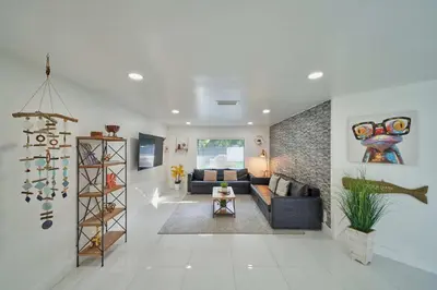 a living room with a couch and a table at Top Location Villa at Highland Lakes Blvd BY THE GLAMHOMES in Miami