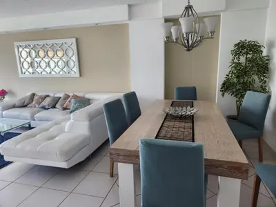 a living room with a table and a couch at Entire Beach Front Condo w/ pool Amazing view 4pax in Miami Beach