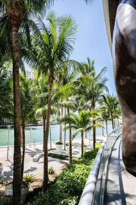 a view of the beach and palm trees from a building at Icon Brickell Stay, Pool, Spa, Views, Restaurants in Miami