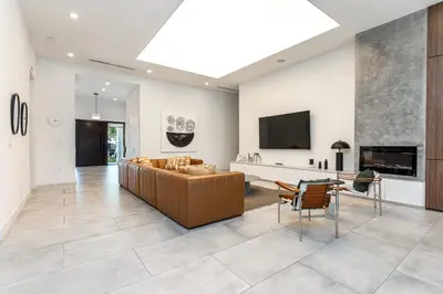 a living room with a couch and a tv at Super Modern Waterfront Paradise Near the Beach in Miami