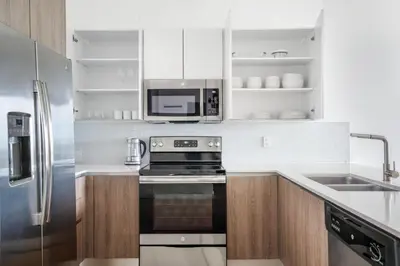 a kitchen with a stove and a microwave at Coral Gables 1br w pool wd nr shops airport MIA-74 in Miami