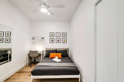 a bedroom with a bed with an orange pillow at Beautiful Shenandoah One Bedroom Fast Internet Shen3 in Miami