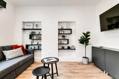 a living room with a couch and a tv at Beautiful Shenandoah One Bedroom Fast Internet Shen3 in Miami