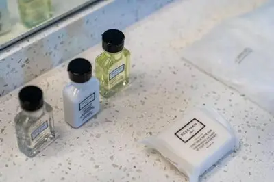 three bottles of soap sitting on top of a counter at VILLA MAGNOLIA-with heated pool-by VIAC in Fort Lauderdale