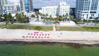 an aerial view of a beach in front of a city at Deluxe Studios and Apartments at the Casablanca in Miami Beach