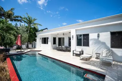 a swimming pool in the backyard of a house at VILLA ST-BARTH Waterfront w htd pool by VIAC in Fort Lauderdale