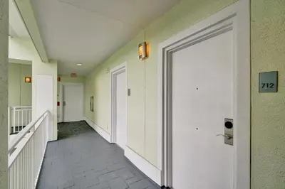 a hallway with a white door and a stairway at Villa Vista-2 Story w 3Bdrms & Golf View in Miami
