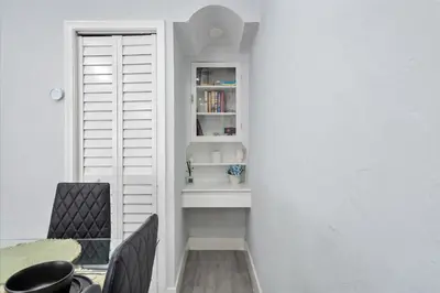 a white room with a table and chairs and a window at Massage Chair - Backyard - 5 min 2 DT Calle 8 Brickell in Miami