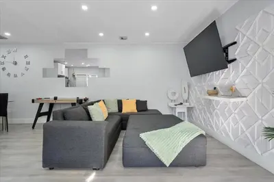 a living room with a couch and a table at Massage Chair - Backyard - 5 min 2 DT Calle 8 Brickell in Miami