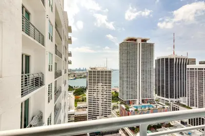 a view of the city from the balcony of a building at Trendy Downtown Miami Studio Pools, Views and More! in Miami