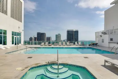 a swimming pool on the roof of a building at Trendy Downtown Miami Studio Pools, Views and More! in Miami
