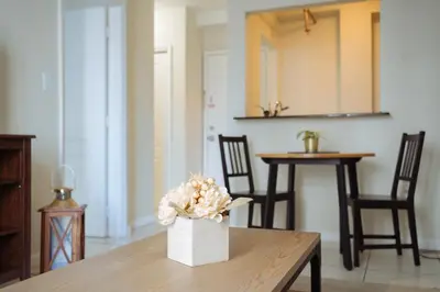 a vase of flowers sitting on top of a table at YOUR VACATION HOME! NEAR THE BEACH in Miami Beach