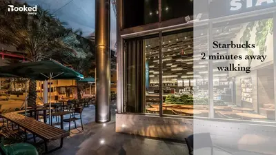 a restaurant with tables and chairs in front of a window at OCEAN & SAND ONLY 1 MINUTE WALK! in Miami Beach