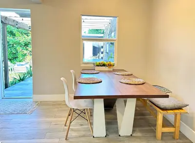 a dining room with a wooden table and chairs at HOT TUB HOUSE ON GOLF COURSE! 10 MINs TO THE BEACH in Miami