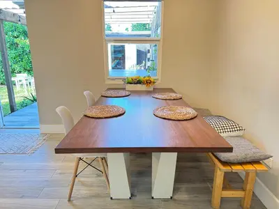 a dining room table with four plates on it at HOT TUB HOUSE ON GOLF COURSE! 10 MINs TO THE BEACH in Miami