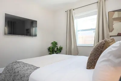 a bedroom with a white bed and a window at La Vie Boheme 1 - Relaxing Retreat w Parking in Miami