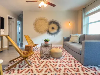 a living room with a couch and a chair at La Vie Boheme 2 - Charming Oasis w Parking in Miami