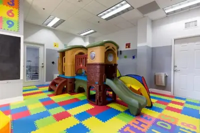 a childs play room with a slide at One of Brickell Bays Best with Pool and Gym Access in Miami