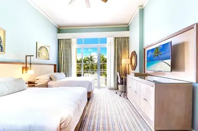 a hotel room with two beds and a television at Stunning Studio Apartment Located at the Ritz Carlton-Key Biscayne in Miami
