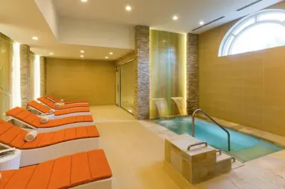 a bathroom with four beds and a bath tub at Stunning Studio Apartment Located at the Ritz Carlton-Key Biscayne in Miami