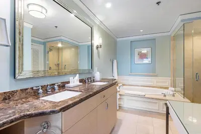 a bathroom with two sinks and a large mirror at Breathtaking 2 Bedroom Condo Placed at Ritz Carlton-Key Biscayne in Miami