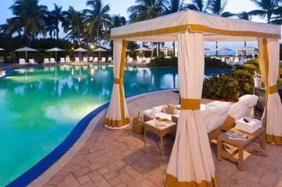 a resort with a pool with a gazebo and a swimming pool at The Palms, Ocean View Studio Located at Ritz Carlton - Key Biscayne in Miami