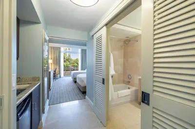 a bathroom with a tub and a bedroom with a bed at Charming 5 Star Condo Unit Situated at Ritz Carlton-Key Biscayne in Miami