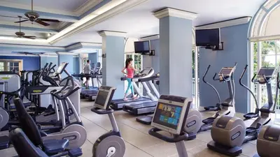 a gym with treadmills and elliptical machines at Lovely Deluxe Unit Located at Ritz Carlton - Key Biscayne! in Miami