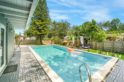 a swimming pool in the backyard of a home at La Playita 4-BR Heated Pool Miami 16 Guests in Miami