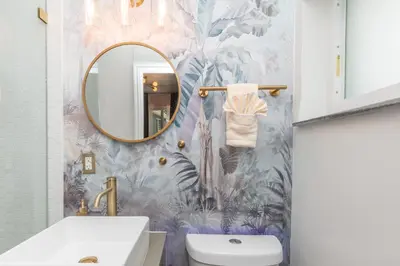 a bathroom with a sink and a mirror at La Playita 4-BR Heated Pool Miami 16 Guests in Miami
