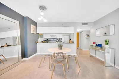 a kitchen and dining room with a table and chairs at Ocean front private unit in Miami